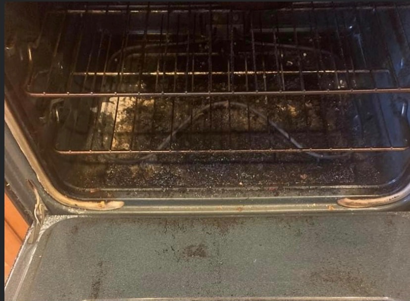 Oven interior with baked-on grease before cleaning