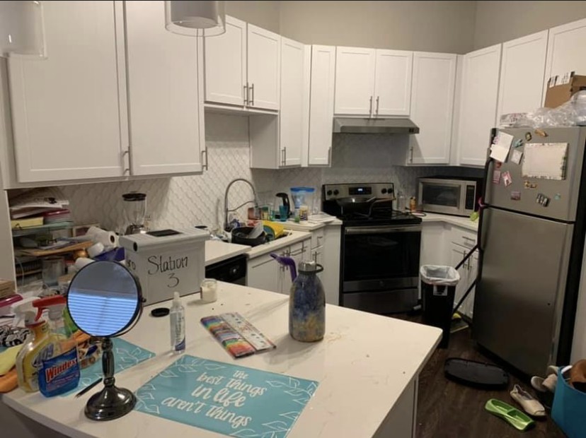 Cluttered kitchen counters before Neatronix cleaning